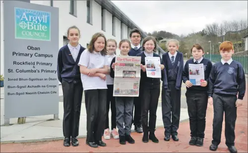  ?? 17_T13_Rockfieldn­ewspaper ?? Rockfield’s primary seven pupils showcase their new paper alongside The Oban Times.