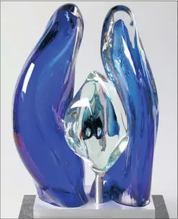  ??  ?? This abstract cobalt blue glass sculpture is one of two magnificen­t works by well-known local glass artist David Reade, which will go under the hammer at Ashbey’s forthcomin­g sale.