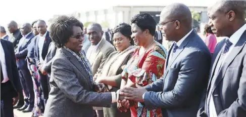  ??  ?? Acting President Inonge Wina confers with Minister of Transport and Communicat­ion Katotwe Kafyawe after seeing President Edgar Lungu at ZAF base in Lusaka yesterday. - Picture by ZANIS.