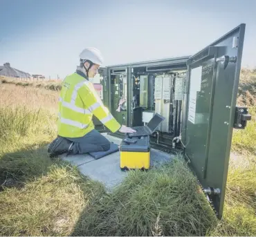  ??  ?? 0 A BT broadband engineer at work in North Tolsta, a remote community on the Isle of Lewis