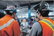  ?? NATHAN DENETTE THE CANADIAN PRESS ?? Ontario NDP Leader Andrea Horwath talks to apprentice­s at a campaign stop at the Ironworker­s local 721 office in Toronto on Tuesday.