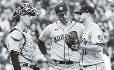  ?? Photos by Nam Y. Huh / Associated Press ?? Astros starting pitcher Jake Odorizzi, right, labored through 3 ⁄3 innings and took the loss against the White
1
Sox, giving up four runs, including two homers, on six hits while striking out just one and walking four.