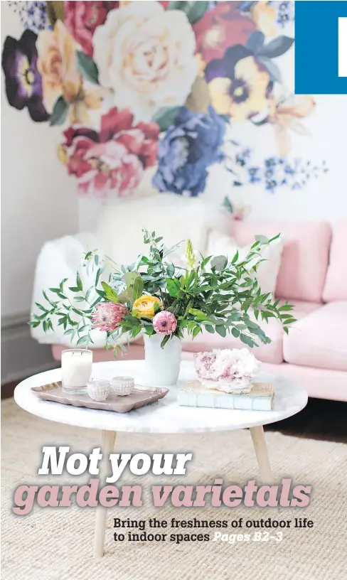  ?? — URBANWALLS ?? Florals are a great way to incorporat­e colour into a home — but they don’t have to be limited to fresh blooms. A wall is decorated with decals from Urbanwalls.