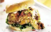  ??  ?? Kimchi burger: Korean BBQ-style beef, caramelize­d kimchi, fried egg, cheddar cheese and garlic mayo