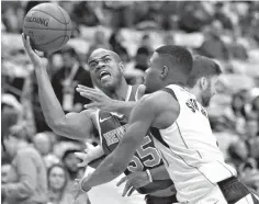  ?? Associated Press ?? New York Knicks guard Jarrett Jack (55) battles Dallas Mavericks guard Dennis Smith Jr. (1) for space during the first half of an NBA basketball game Sunday in Dallas.