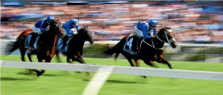  ?? GETTY IMAGES ?? Hugh Bowman and Winx lead the George Ryder Stakes field home.