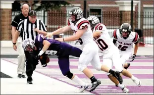  ?? Photograph­s courtesy of Stephanie Harwell ?? Blackhawk defenders (above) Tristin Brewer (No. 25), Carson Rhine (No. 10) and Justin Koon (No. 16) prevent the Lion ball carrier from proceding downfield. Blackhawk senior Drew Winn (photo at left) scored four touchdowns, rushing for 170 yards on 25...