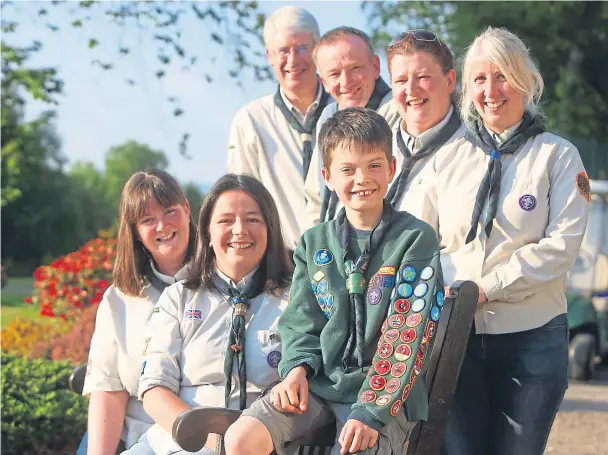  ?? Picture: Kris Miller. ?? Gregor Kennedy of Kirriemuir with his sleeve full of badges and from left Emma Kennedy, Arlene Walker, Chris Lindley, Ian Fleming, Lisa Simpson and Linda Chudek.