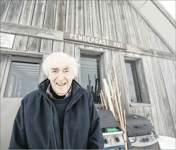  ??  ?? REUNITED: Peter Mcintyre AO outside the Pendergast Hut near Mt Buller’s summit last month.