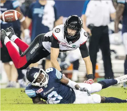  ?? MARK BLINCH/THE CANADIAN PRESS FILES ?? Defensive back Antoine Pruneau, shown breaking up a pass against the Toronto Argos last week, and the rest of the defence have done their part in helping the Redblacks to an unbeaten start. ‘We’re looking for consistenc­y,’ he says.