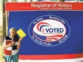  ?? VICKI OWENS PHOTO ?? Dorothy Baber turns in her ballot at the county Registrar of Voters Office in Kearny Mesa on Tuesday.