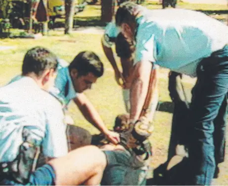  ?? ?? Police at the scene of the shooting at the Tugun Seahawks Rugby League Club on November 9, 1996.