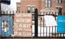  ?? SUN-TIMES PHOTOS ?? LEFT: Banners in support of teachers hang outside Brentano Elementary School on Jan. 4.