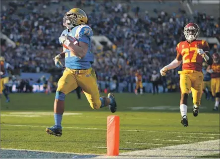  ?? Photograph­s by Wally Skalij Los Angeles Times ?? UCLA’S JOSHUA KELLEY won’t be caught as his 55-yard touchdown run gives the Bruins the lead for good in the fourth quarter.