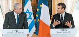  ?? STEPHANE MAHE/GETTY-AFP ?? Israel’s Benjamin Netanyahu, left, and France’s Emmanuel Macron met Sunday in Paris.