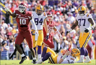  ?? Democrat-Gazette file photo ?? Arkansas defensive end Randy Ramsey (10), shown after making a sack against LSU last season, figures to excel in defensive coordinato­r John Chavis’ more aggressive pass rushing plans. “He’s a natural,” Chavis said of Ramsey. “No question about it.”