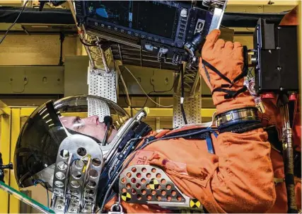  ?? NASA ?? Dustin Gohmert begins a simulated Orion launch. “Your cheeks are literally trying to jump off your face,” an engineer says.