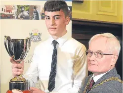  ?? Picture: Kim Cessford. ?? Competitio­n winner Lewis Neilson receives his trophy from Lord Provost Ian Borthwick yesterday afternoon.