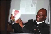  ??  ?? Professor Mutambara displays his new book during the recent launch in Mutare