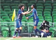  ??  ?? Arsenal’s Mohamed Elneny celebrates scoring his side’s second