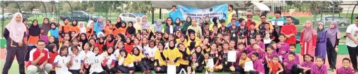  ??  ?? ZAKARIA (tengah) bergambar kenangan bersama AJK Pengelola, guru pengiring dan para pemain hoki B12 lelaki dan perempuan MSSD Sandakan.