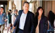  ??  ?? Tom Hanks (left) reprising his role as Harvard University professor Robert Langdon and Sienna Brooks (Felicity Jones) in the movie Inferno.