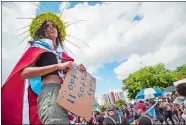  ?? DENNIS M. RIVERA PICHARDO/AP PHOTO ?? Thousands of Puerto Ricans gather for what many are expecting to be one of the biggest protests ever seen in the U.S. territory, with irate islanders pledging to drive Gov. Ricardo Rossello from office, in San Juan on Monday.