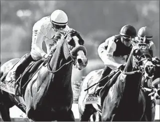  ?? JAE C. HONG/AP ?? Trainer Bob Baffert’s horse Justify, left, is expected to be one of the favorites for this year’s Kentucky Derby. About 6:30 p.m. Saturday, NBC