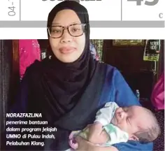  ??  ?? NORAZFAZLI­NA penerima bantuan dalam program Jelajah UMNO di Pulau Indah, Pelabuhan Klang.