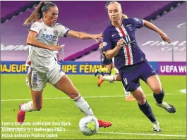  ??  ?? Lyon's Icelandic midfielder Sara Bjork Gunnarsdot­tir (L) challenges PSG's Polish defender Paulina Dudek