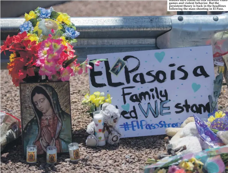  ??  ?? Flowers and a Virgin Mary painting adorn a makeshift memorial for the victims of Saturday mass shooting at a shopping complex in El Paso, Texas. Scientific studies have found no link between video games and violent behavior. But the persistent theory is back in the headlines following the mass shooting in El Paso.