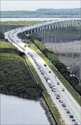  ?? Alan Diaz ?? The Associated Press Motorists head north Wednesday on U.S. Highway 1 in Key Largo, Fla., in anticipati­on of Hurricane Irma, which could strike the Miami area by early Sunday.