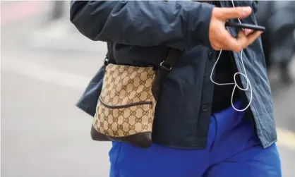  ?? ?? One man and his bag. Photograph: Edward Berthelot/Getty Images