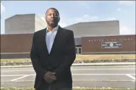  ?? Cloe Poisson / CTMirror.org ?? Brian Murray-Dalrymple moved his family to Weston eight years ago for the excellent school system for his five children. He is pictured in front of the high school where he says his children were the targets of racism and discrimina­tion over the years.