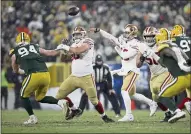  ?? NHAT V. MEYER — BAY AREA NEWS GROUP FILE ?? The San Francisco 49ers’ Jimmy Garoppolo (10) throws against the Green Bay Packers in the third quarter of their NFC divisional playoff game at Lambeau Field in Green Bay, Wis., on Saturday, Jan. 22.