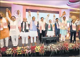  ??  ?? BJP president J P Nadda with Union minister NS Tomar, Assam CM Sarbananda Sonowal and others at the release of the party's election manifesto in Guwahati on Tuesday.