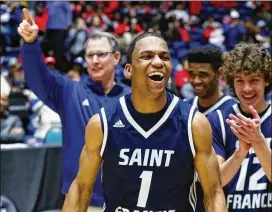  ?? CURTIS COMPTON / CCOMPTON@AJC.COM ?? St. Francis coach Drew Catlett (from left), guard Dwon Odom and teammates celebrate their 73-69 win over ELCA on Wednesday.