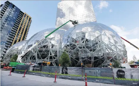  ?? ELAINE THOMPSON/THE ASSOCIATED PRESS FILES ?? The expansion of the Amazon.com campus in downtown Seattle is seen in April. Amazon said last week that it will spend more than US$5 billion to build another headquarte­rs in North America to house as many as 50,000 employees.