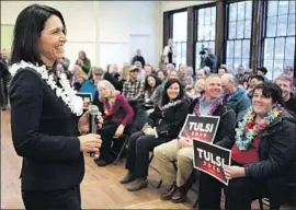  ?? Steven Senne Associated Press ?? REP. TULSI GABBARD (D-Hawaii) in North Hampton, N.H. Turnout was high at events across the state, including for lower-profile candidates like Gabbard.