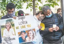  ?? Nick Otto / Special to The Chronicle ?? Daniel Ramos’ siblings and father, Kamron, Samantha and Amir Ivari, attend a vigil on Thursday at Hayes and Polk in S.F.