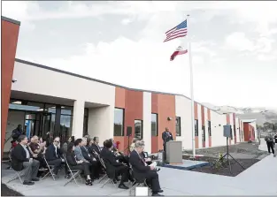  ?? PHOTO BY JUBIL MATHEW ?? Members of the Milpitas Unified and San Jose-evergreen Community College districts’ boards of education listen to Byron Breland during a ribbon-cutting ceremony for the San Jose Evergreen-musd college extension in this file photo. Breland in November stepped down as chancellor of San Jose-evergreen to take the same job at the North Orange County Community College District.