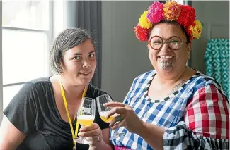  ?? JO MCLEOD ?? Above, a Camp Boom attendee with artist Lissy Robinson Cole at the inaugural 2020 Camp Boom; at right, Attendees crafting at the 2020 event, which many called ‘‘life-changing’’.