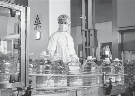  ?? PROVIDED TO CHINA DAILY ?? A Louis Dreyfus Co employee works on a production line in Tianjin.