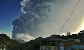  ?? Photograph: Orvil Samuel/AP ?? Ash rises into the air as La Soufrière volcano erupts on the eastern Caribbean island of St Vincent on Tuesday.