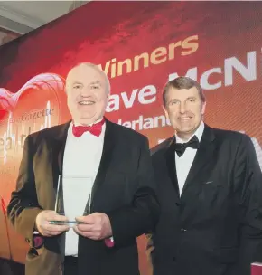  ??  ?? Dave McNicholas gets his Long Term Achievemen­t award from Ken Bremner, c hief executive of City Hospitals Sunderland NHS Foundation Trust and South Tyneside NHS Foundation Trust, at last year’s Best of Health Awards.