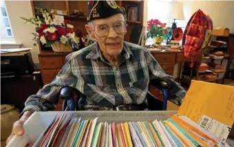  ?? STuART CAHiLL / HERALD STAFF ?? MAIL CALL: Butler shows off some of the birthday cards and other mail he’s gotten from well-wishers.