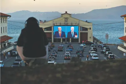  ?? Scott Strazzante / The Chronicle ?? President Trump and former Vice President Joe Biden appear on a screen at Fort Mason in San Francisco at a debate watch party organized by business owner Manny Yekutiel. Many viewers saw something they didn’t expect — normality.