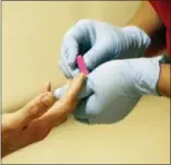  ?? ASSOCIATED PRESS
FILE PHOTO ?? In this May 1, 2013, file photo, a lab technician draws blood from a patient at a health center, in Phoenix. As health insurance plans become increasing­ly complicate­d, more patients are facing unexpected fees when they step outside their plan’s coverage network.