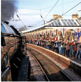  ?? NIGEL HARRIS ?? From the footplate: extraordin­ary crowds greet No. 60163 at Skipton on the second day of ‘Plandampf’.