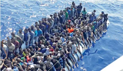  ?? AP ?? Migrants on a ship intercepte­d offshore near the town of Gohneima, east of the capital, Tripoli. There were four boats, boarding 490 African migrants including 75 women and 21 child, on Sunday. —